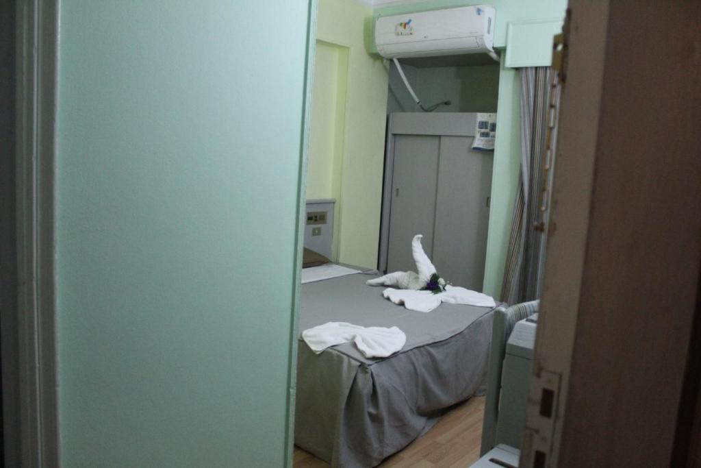 Postel nebo postele na pokoji v ubytování Emilio Hotel