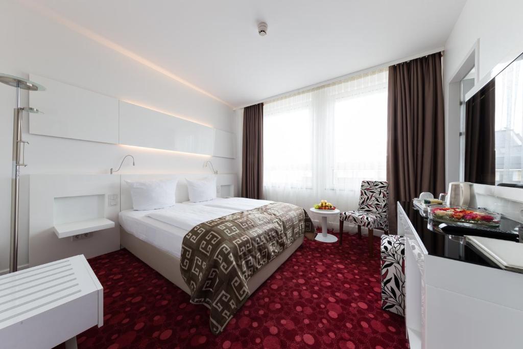 Postel nebo postele na pokoji v ubytování Hotel Bayer's