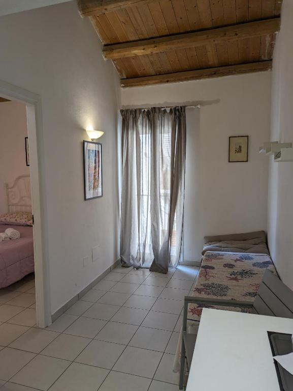 Posteľ alebo postele v izbe v ubytovaní atocà3 casa vacanze - vedi anche atocà1 e atocà2