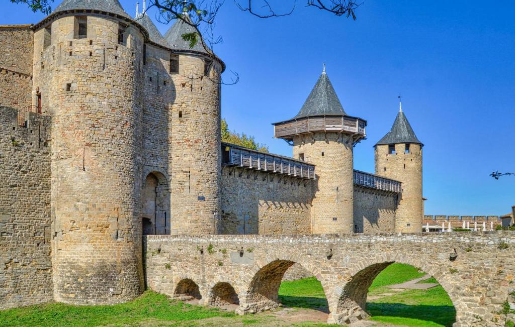 a castle with two towers and a bridge at Beautiful Home In Saint-laurent-de-la-cabrerisse With Kitchen in Saint-Laurent-de-la-Cabrerisse