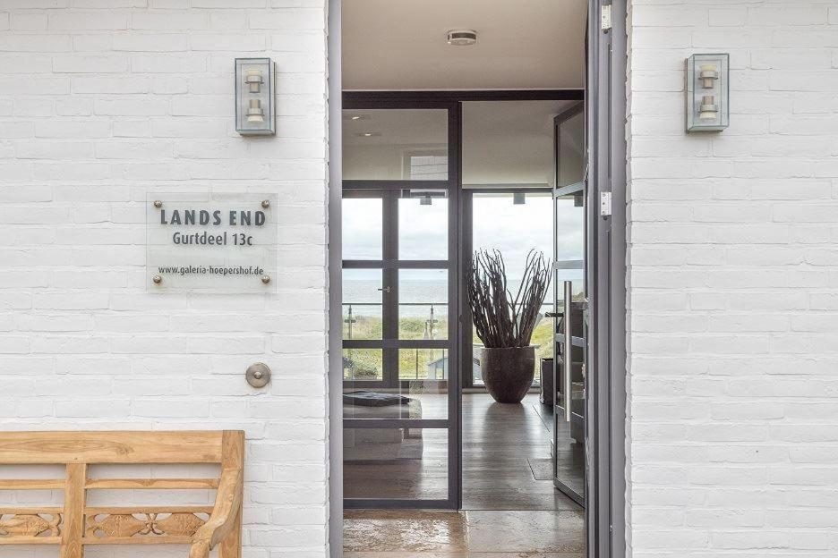 a entrance to a building with a glass door at Lands-End in Hörnum