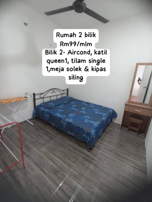 Postel nebo postele na pokoji v ubytování Haji Ineng Homestay- Guest House