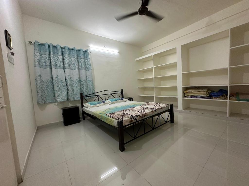 a bedroom with a bed in a room at 402 @ Vistaram in Vizianagram City