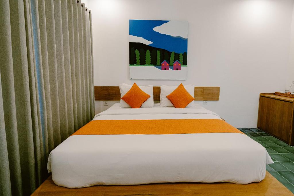 Postel nebo postele na pokoji v ubytování Brown Feather Hotel