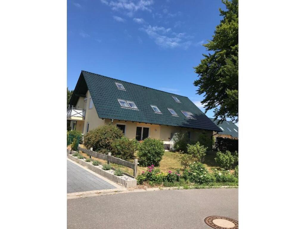 a house with a roof with windows on it at Wood in Zempin Usedom in Zempin