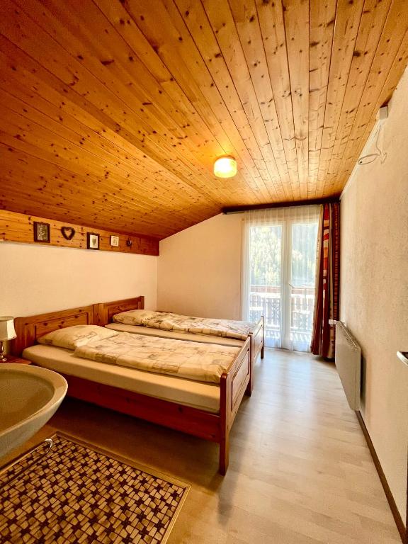 Voodi või voodid majutusasutuse Holiday House Lärchenheim toas