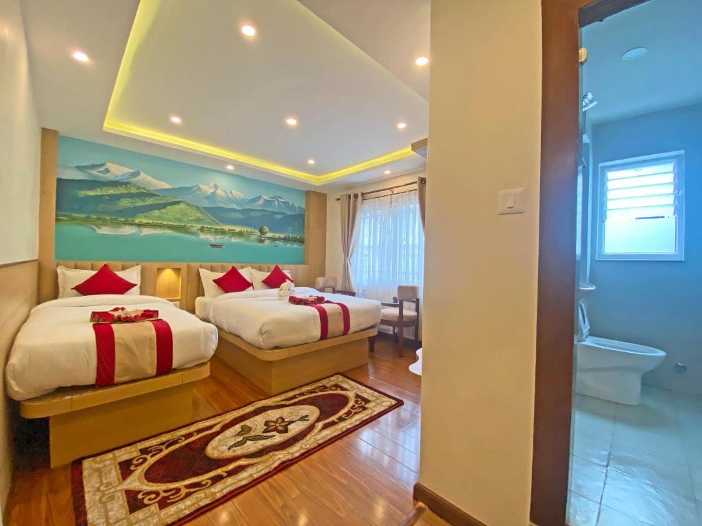 Postel nebo postele na pokoji v ubytování Hotel Malati