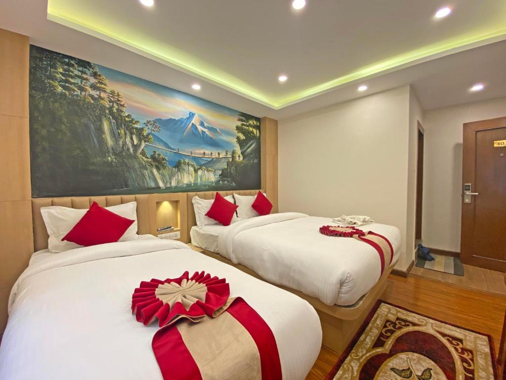 Postel nebo postele na pokoji v ubytování Hotel Malati