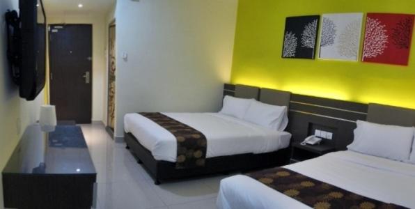 Postel nebo postele na pokoji v ubytování GM Holiday Hotel