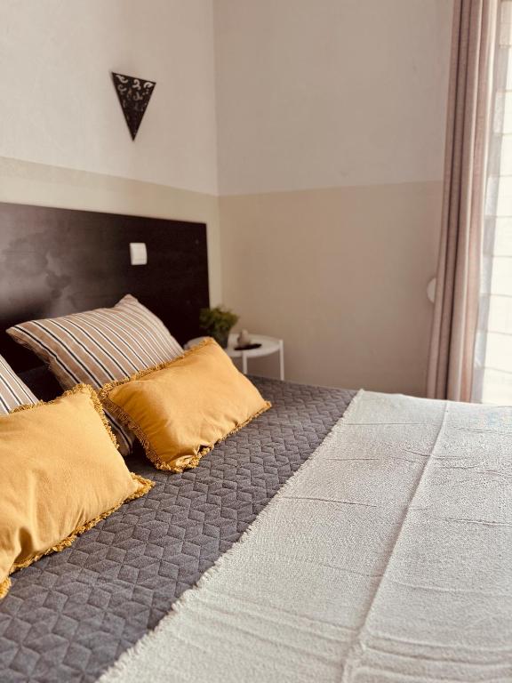 Postel nebo postele na pokoji v ubytování Hôtel le Nid