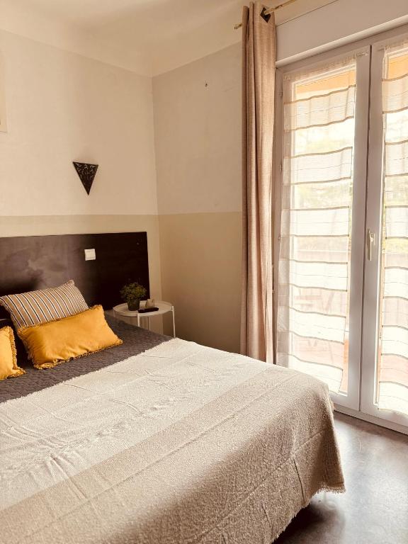 Postel nebo postele na pokoji v ubytování Hôtel le Nid