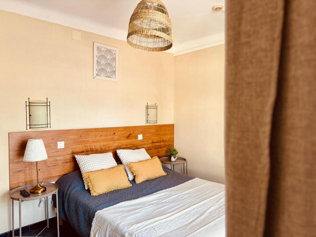 Postel nebo postele na pokoji v ubytování Hôtel le Nid