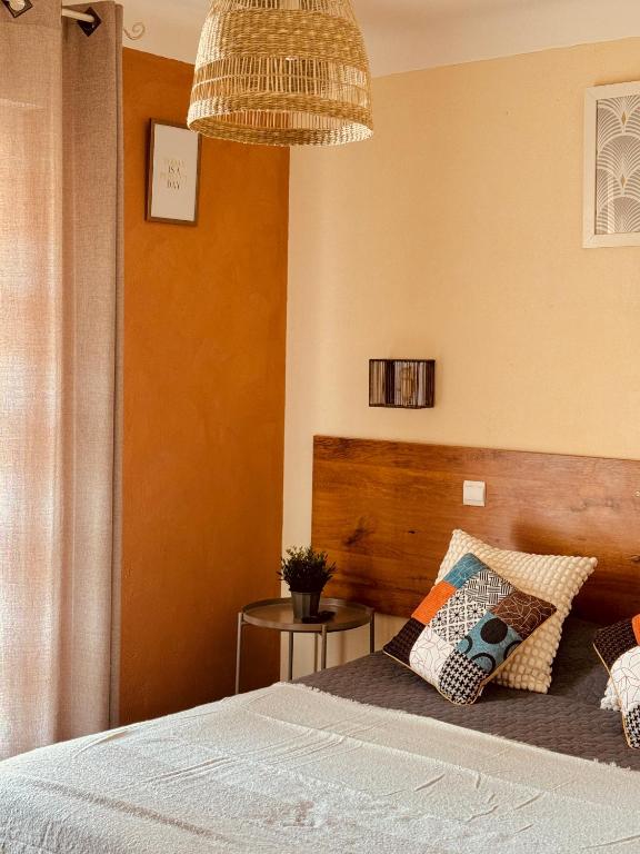 Postel nebo postele na pokoji v ubytování Hôtel le Nid