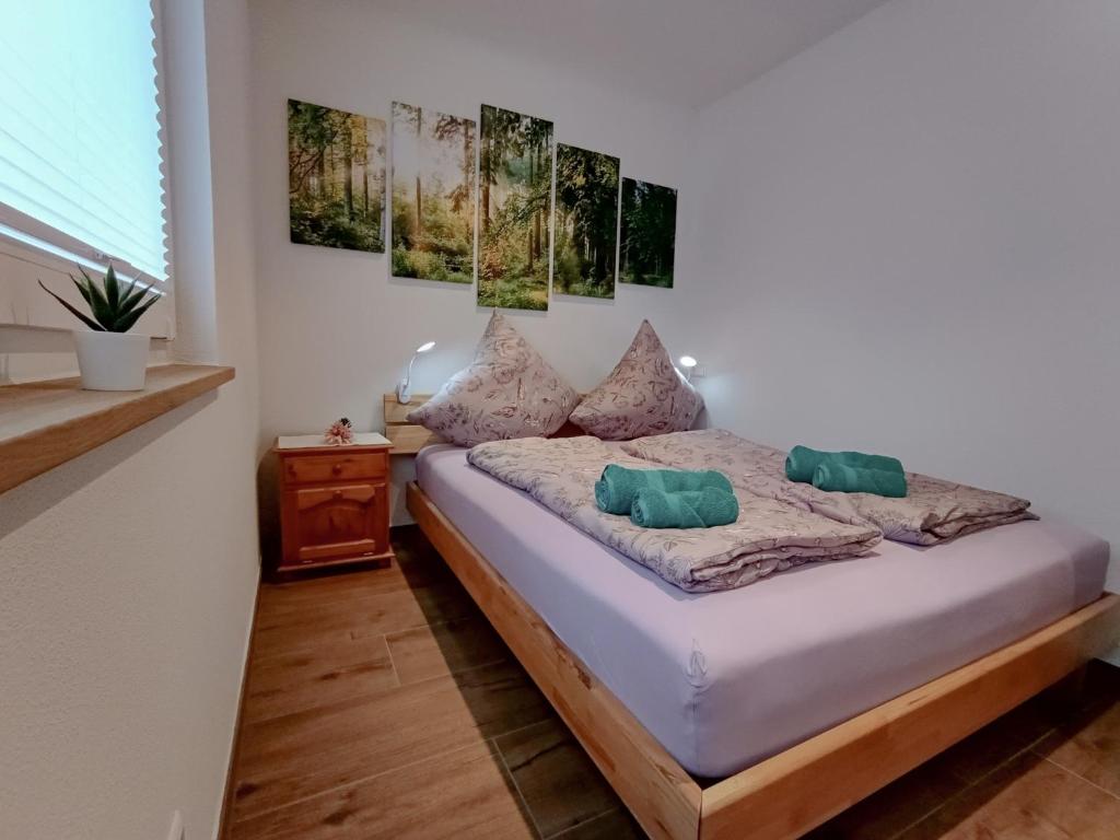 a bedroom with a bed with two pillows on it at Ferienwohnung Landliebe in Ravensburg