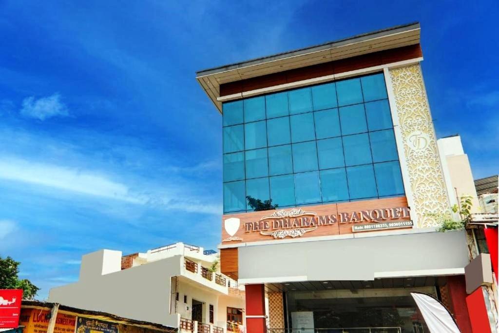 a building with a sign that reads the shanghai hamburger at The Dharams Hotel in Lucknow