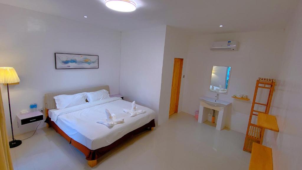 Postel nebo postele na pokoji v ubytování Green Mango Resort