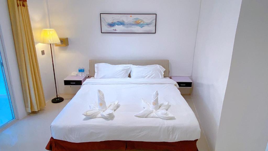 Postel nebo postele na pokoji v ubytování Green Mango Resort