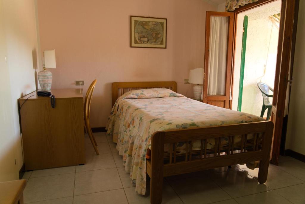 Postel nebo postele na pokoji v ubytování Albergo San Lorenzo
