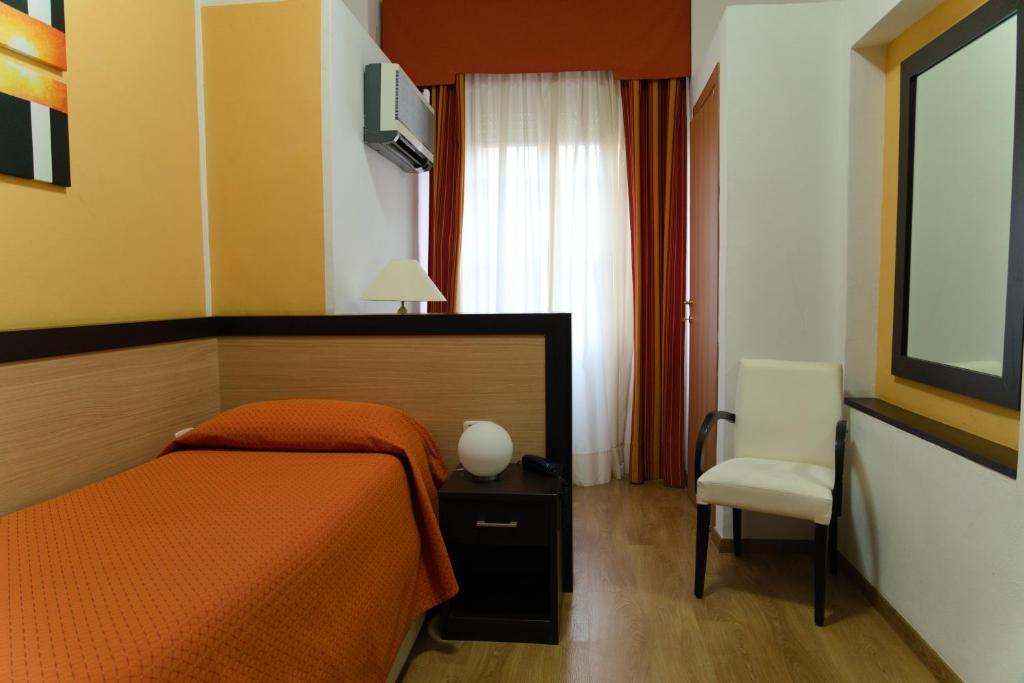 Postel nebo postele na pokoji v ubytování Albergo San Lorenzo