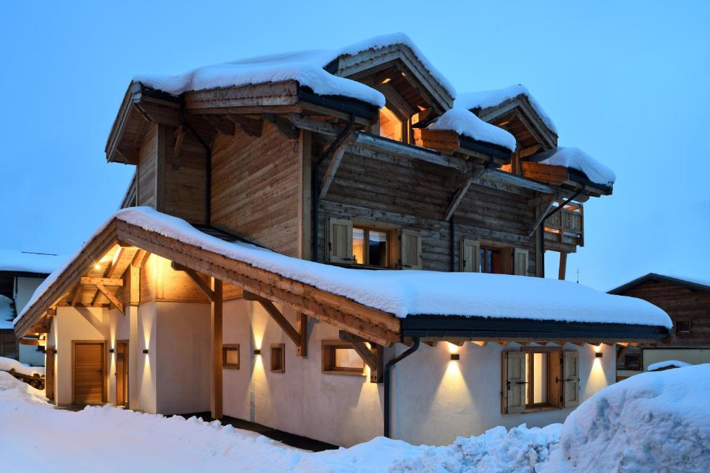 a house covered in snow in the snow at Chalet Fabriel in Montgenèvre