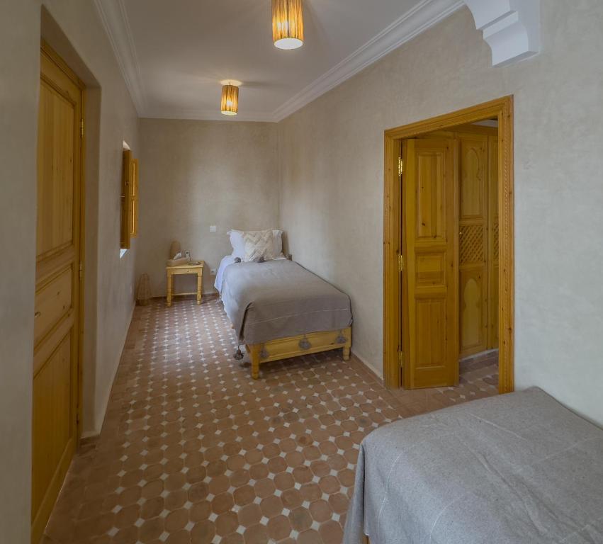Postel nebo postele na pokoji v ubytování Riad & SPA Privé - La Perle d'Orane - Marrakech