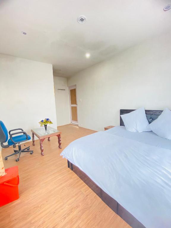 Postel nebo postele na pokoji v ubytování Pall Residency