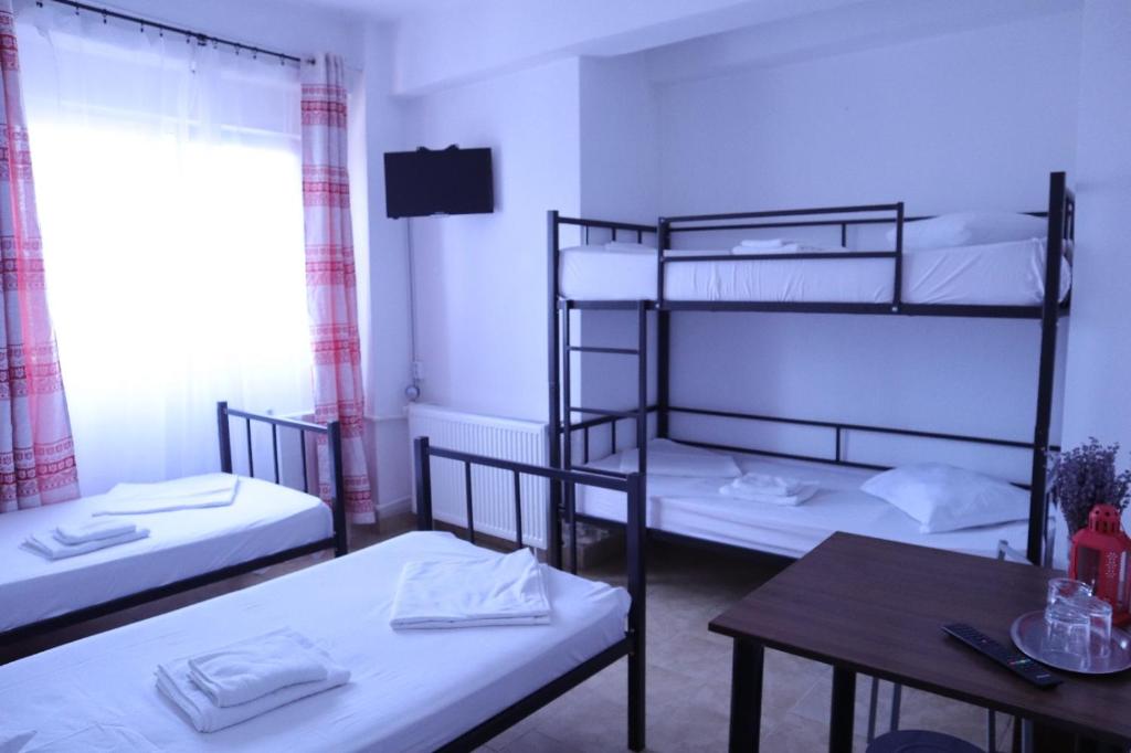 Postel nebo postele na pokoji v ubytování Taxi Hostel