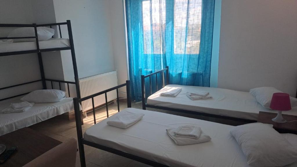 Postel nebo postele na pokoji v ubytování Taxi Hostel