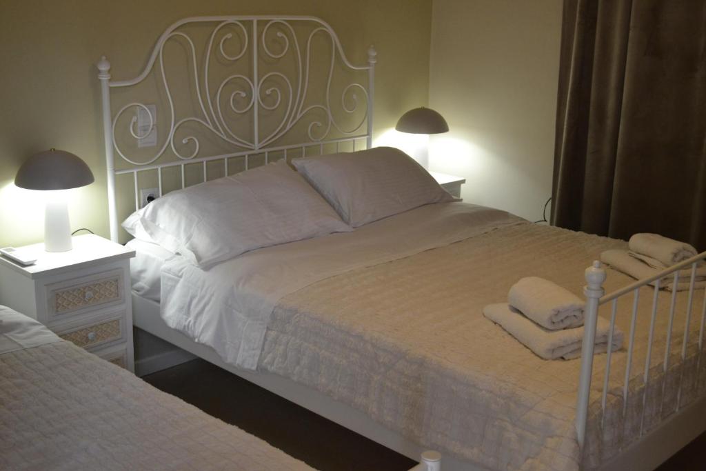 A bed or beds in a room at Margarita rooms
