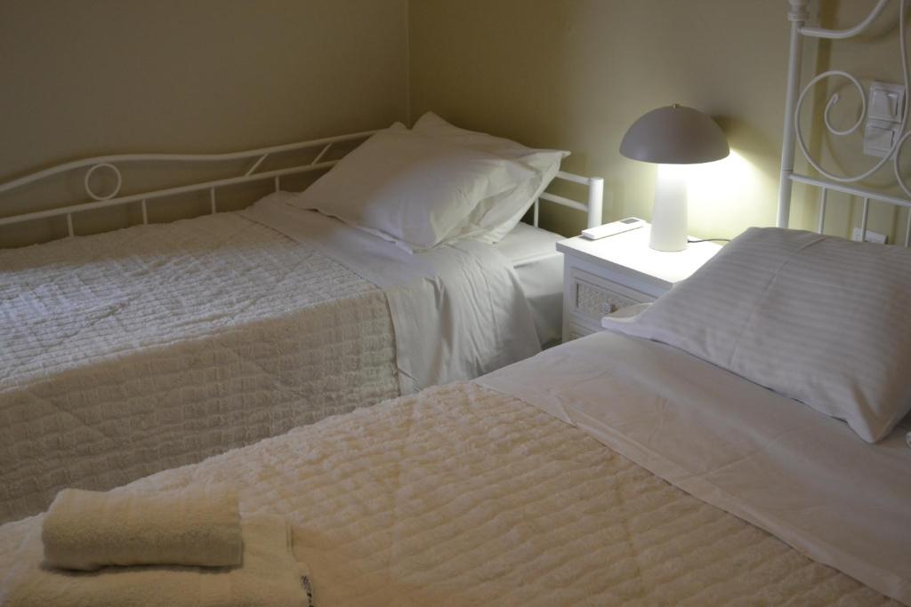 A bed or beds in a room at Margarita rooms