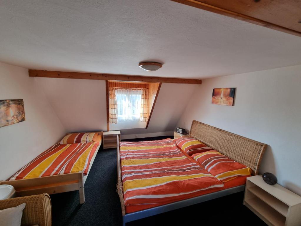 Postel nebo postele na pokoji v ubytování Penzion Tomy Pihlov