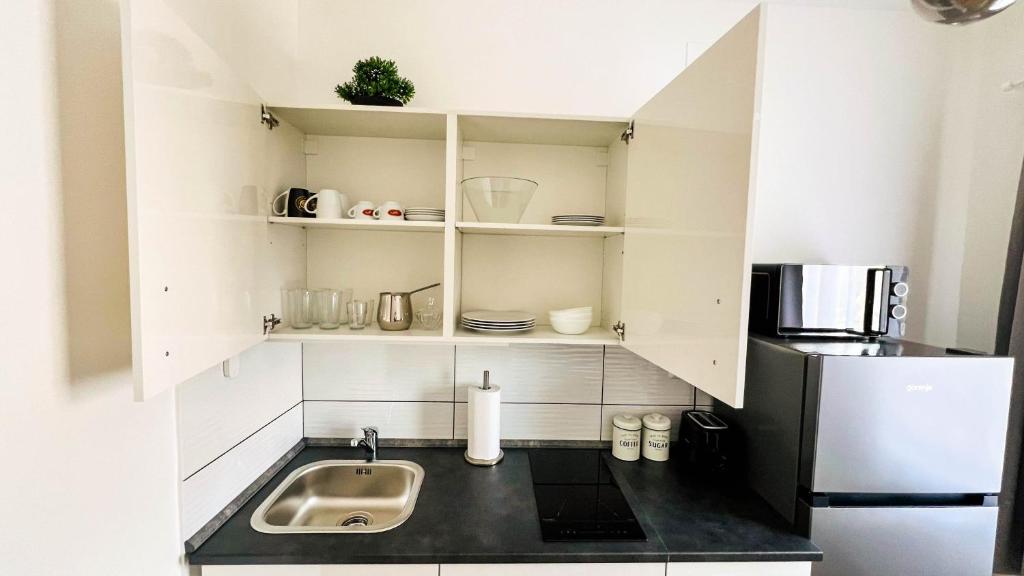 Kuchyň nebo kuchyňský kout v ubytování Rooms Koblar