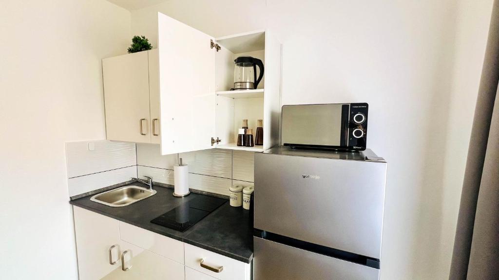 Kuchyň nebo kuchyňský kout v ubytování Rooms Koblar