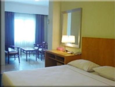 Postel nebo postele na pokoji v ubytování Hotel Wisata
