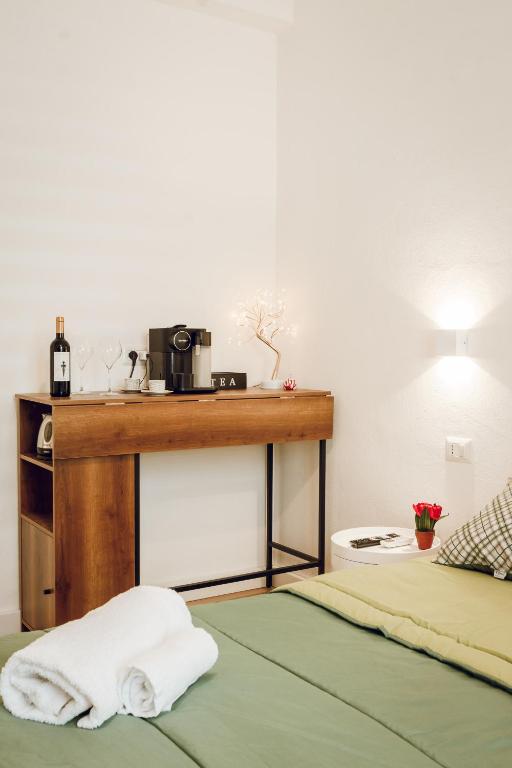 Postel nebo postele na pokoji v ubytování SUITES DELUXE FRONT SEA, Domus Lumeras