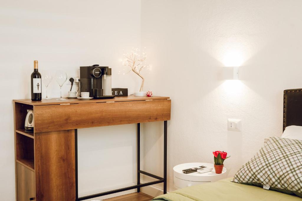 Postel nebo postele na pokoji v ubytování SUITES DELUXE FRONT SEA, Domus Lumeras
