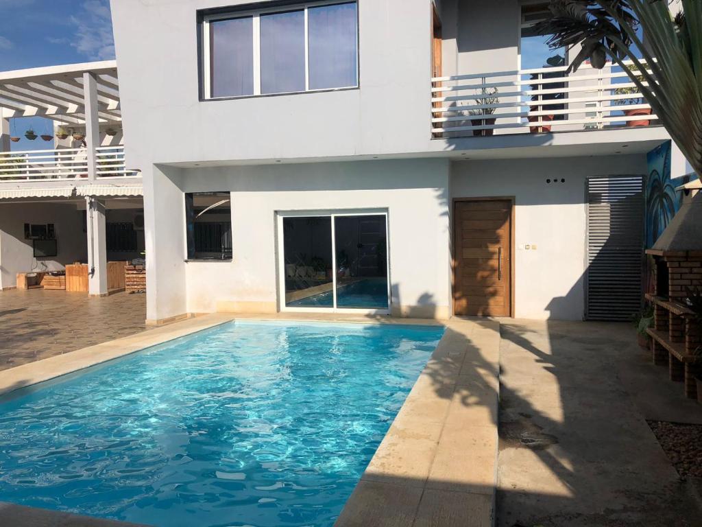 a house with a swimming pool in front of a house at JUCENTE_ALOJAMENTO_LOCAL in Quifica