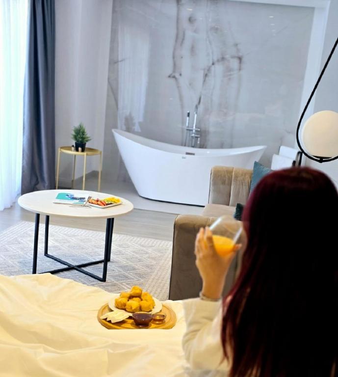 Postel nebo postele na pokoji v ubytování Perla Hotel