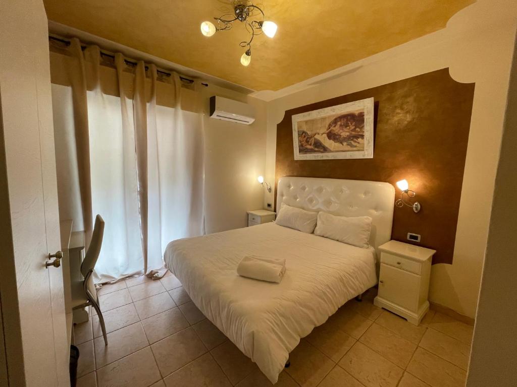 Postel nebo postele na pokoji v ubytování Hotel Central Giacomini