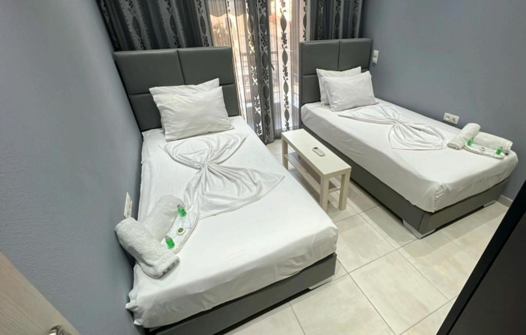 Postel nebo postele na pokoji v ubytování Moza House