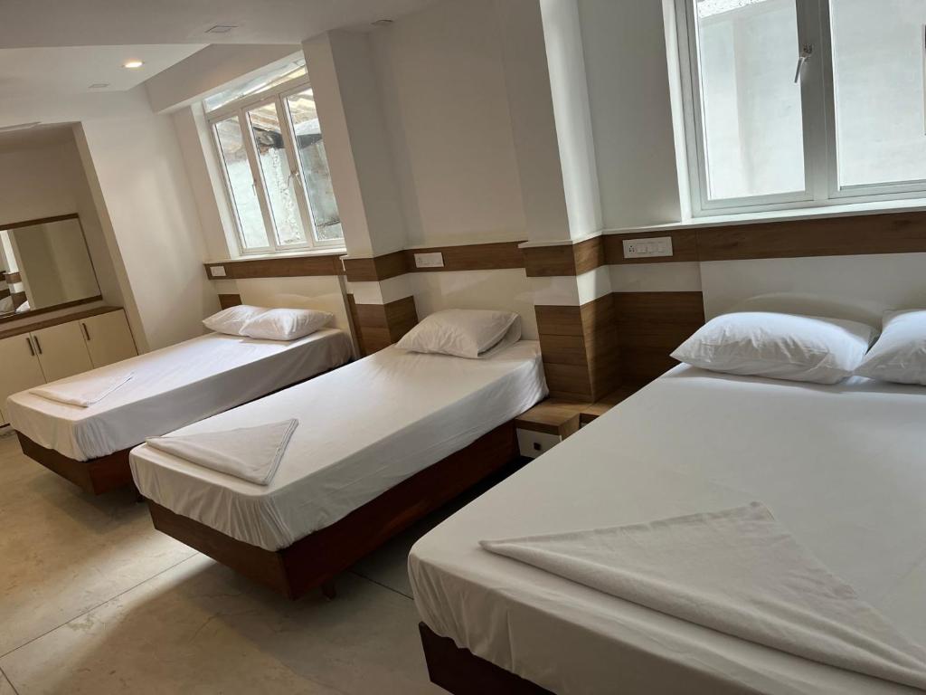 A bed or beds in a room at Welcome Hotels