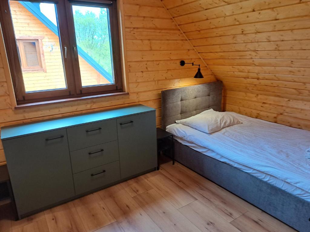 Łóżko lub łóżka w pokoju w obiekcie Kamienica House 9