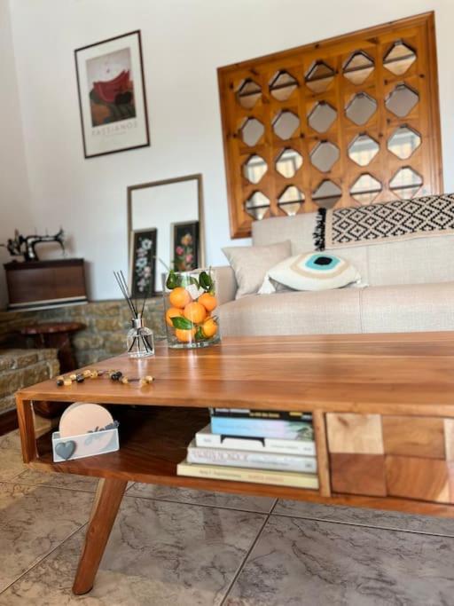 a living room with a bed and a coffee table at ktima_countryliving in Samos