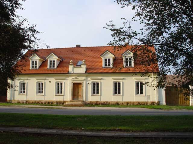 a large white house with a red roof at Penzion Záhornice 