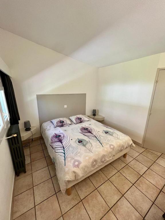Postel nebo postele na pokoji v ubytování Moulin de la Sambuc