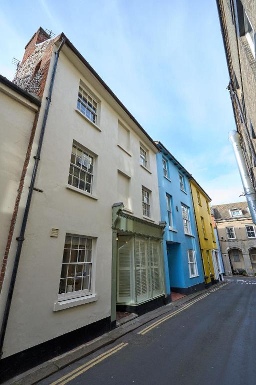 a row of buildings on a city street at Surf Cottage in Cromer