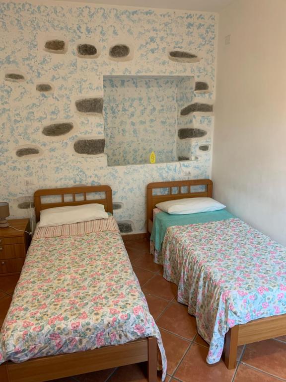 Postel nebo postele na pokoji v ubytování I Limoni 3