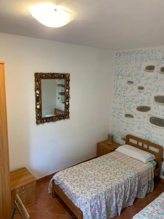Postel nebo postele na pokoji v ubytování I Limoni 3