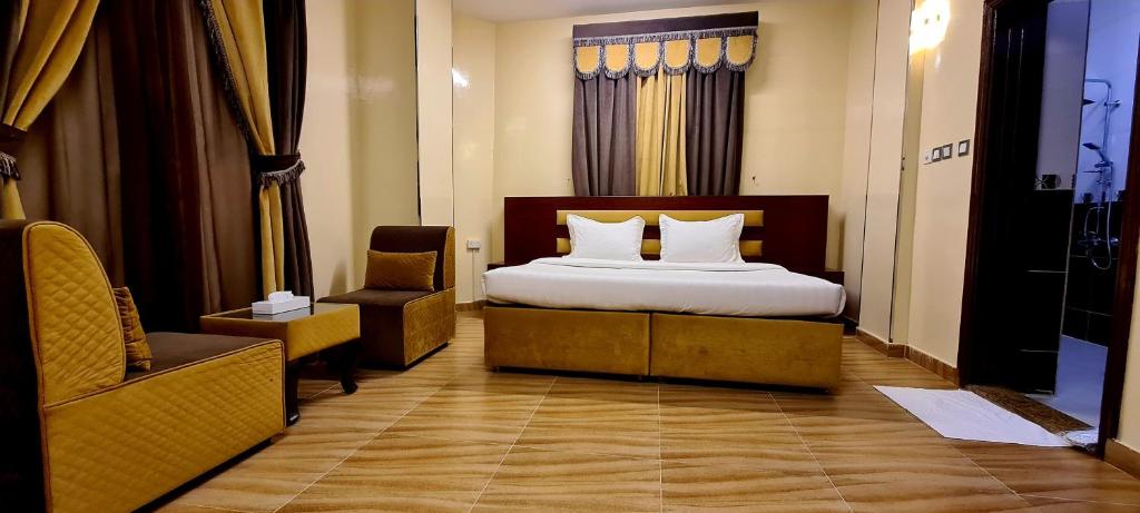 Postel nebo postele na pokoji v ubytování AL AMAN HOTEL