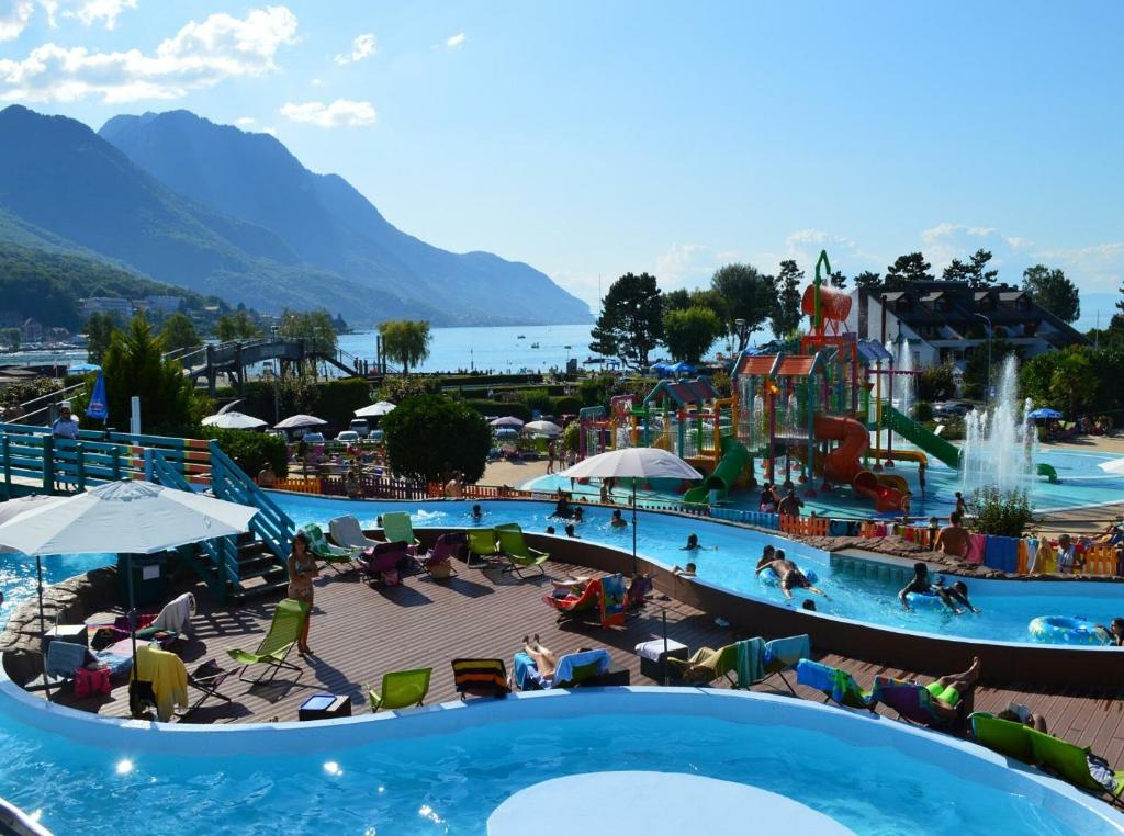 a view of an amusement park with a water park at Appartement Les Salines in Roche